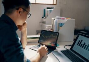 Mid adult man working on his personal finance in his home office - stock photo