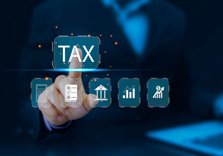 usinessman using laptop to fill in the income tax online return form for payment.business using computer filling personal income tax return to pay tax.
