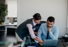 Worried and unworried partners at the office