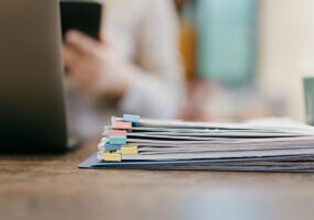 Close-up file papers in women office - stock photo