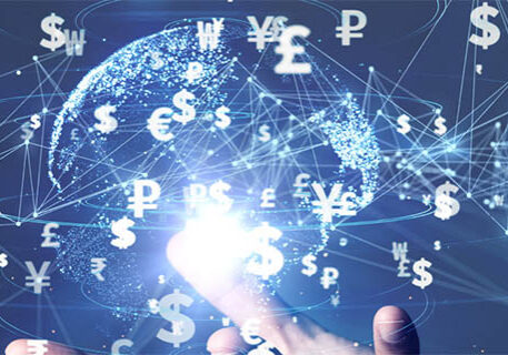 digital illustration of hand holding transparent globe with international currency floating around it